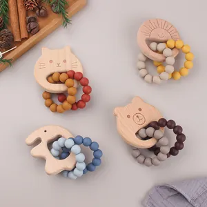 DIY beech wood and silicone baby teether bracelets featuring cat and animal shapes