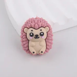 Close-up of a pink cartoon hedgehog silicone bead for DIY crafting and teething toys