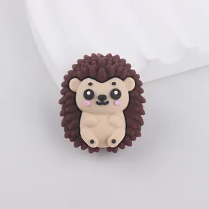 Detailed view of a brown silicone hedgehog bead with 3D texture for DIY crafts