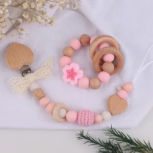 Newborn beech wood and silicone floral teething ring set with a pacifier clip