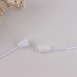 Detail of white plastic safety breakaway clasp and woven cord for baby teething necklace
