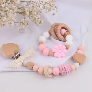 Beech wood and silicone baby rattle set with daisy flower teether and pacifier clip