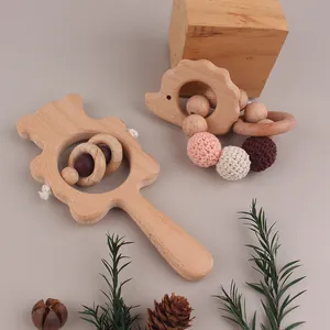 Detail of beech wood bear rattle and crochet bead hedgehog teething ring set