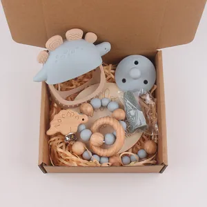 Siliconen dinosaurus bijtring set met fopspeen en rammelaar in geschenkdoos