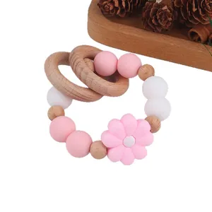 Beech wood and silicone baby rattle teether with pink daisy flower and macaron beads