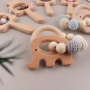 Detail of beech wood elephant teether with crochet beads and wooden rattle ring