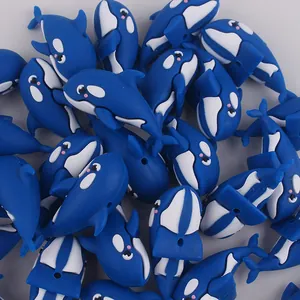 Detail of blue and white silicone orca beads for DIY baby pacifier chains and jewelry