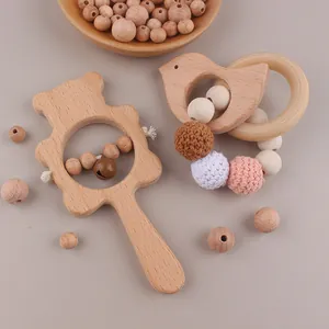 Detailed macro view of beech wood bear rattle and silicone crochet bead baby teether set