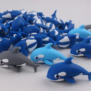 Detailed close-up of cute 3D orca whale silicone beads for DIY pacifier clips and crafts