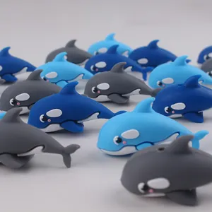 Macro detail of cute 3D cartoon silicone orca dolphin beads in blue and grey for DIY crafts