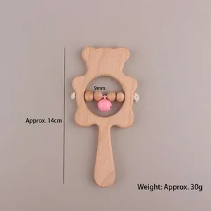 Handcrafted beech wood bear rattle for infants with pink bell and easy-grip handle