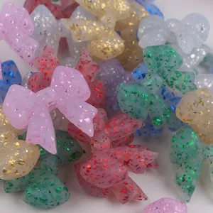 Macro shot of colorful glitter silicone bow beads for DIY baby teething necklaces
