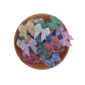 Glittering bow silicone beads for baby jewelry making in various colorful resin styles
