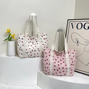 Pink and white corduroy tote bags with strawberry print for casual commuting