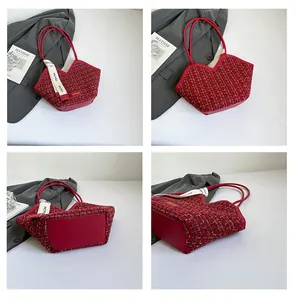 Detail of red tweed tote bag with woven gold thread and decorative floral ribbon