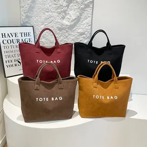 Minimalist tote bag for women in four elegant colors with stylish TOTE BAG lettering