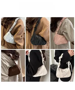 Detail view of stylish pleated underarm bags for women in six various trendy colors