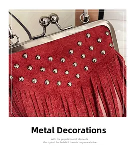 Macro detail of red matte leather bag featuring silver metal studs and tassel fringe