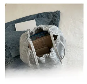 Interior view of grey quilted bucket bag showing storage capacity for daily essentials