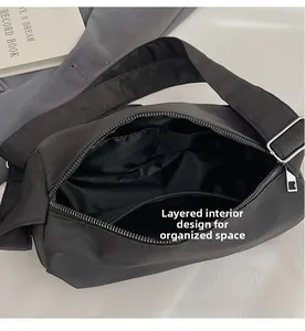 Macro shot of the black nylon bag interior with zippered pocket and dividers