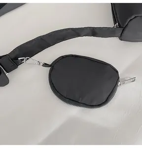 Detailed view of adjustable wide nylon shoulder strap with a detachable round coin purse