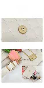 Detail of cream quilted crossbody bag featuring gold hardware and interior storage space