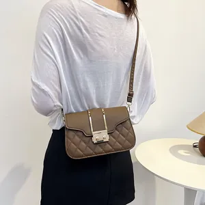 Chic dark brown quilted shoulder bag with gold metal buckle and leather strap for women