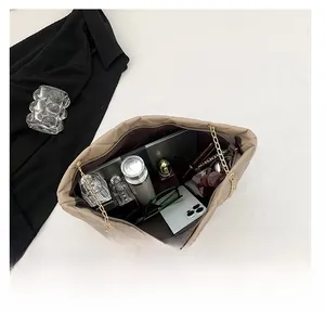 Spacious interior of a quilted tote bag showing storage for laptop and daily essentials