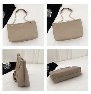 Detail view of khaki quilted tote bag with herringbone pattern and gold chain strap