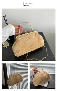 Detail of khaki faux fur handbag with golden metal frame, sphere lock and floral handle