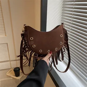 Dark coffee crescent tassel crossbody bag with metallic studs and suede texture
