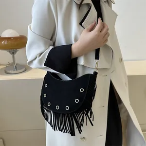 Black crescent moon fringe bag with metal rivets and crossbody strap for women