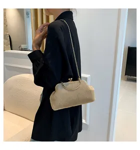 Chic beige faux fur shoulder bag with gold chain strap and metal kiss-lock closure
