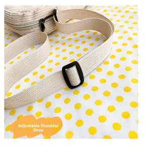 Close-up of the adjustable nylon shoulder strap on this corduroy teddy bear crossbody bag
