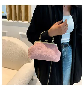 Pink faux fur handbag with gold metal handle and chain strap for autumn winter fashion