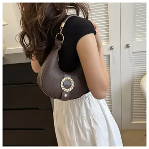 Brown lychee leather underarm bag with gold metal handle and rippled buckle