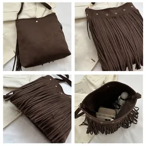 Detail shot of coffee brown fringe shoulder bag with high-quality suede texture and gold zipper