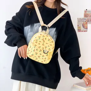 Mini yellow corduroy backpack with cherry print for women, casual and sweet style