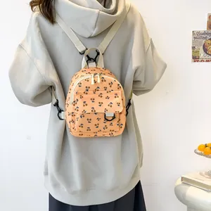 Corduroy mini backpack for women featuring cute cherry print and adjustable straps