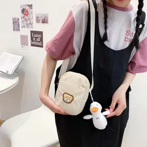 Cute corduroy bear crossbody bag for girls with plush duck pendant in cream white