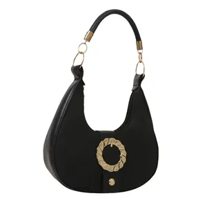 Retro black leather crescent hobo bag with textured finish and gold circular hardware