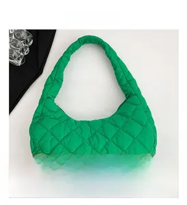 Close-up of bright green quilted shoulder bag featuring premium diamond stitching and texture
