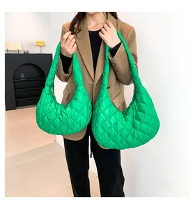 Detailed comparison of bright green quilted puffer bags in large and small sizes