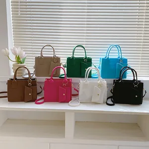 Set of embossed felt tote bags with matching coin purses in seven vibrant colors
