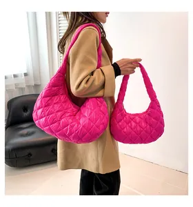 Detailed comparison of large and small quilted fuchsia cloud bags with rhombic stitching