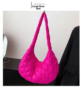 Large rose red quilted puffer shoulder bag with elegant diamond stitching in detail