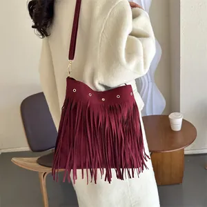 Bohemian dark red suede shoulder bag with gold rivets and long fringe tassels
