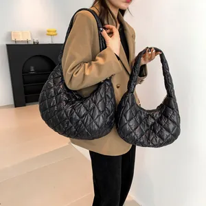 Quilted black cloud shoulder bag with diamond stitch and glossy nylon finish
