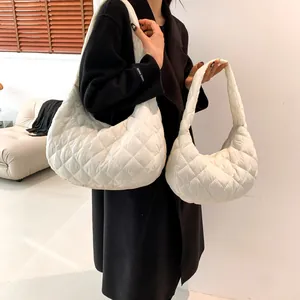 White quilted cloud shoulder bag in large and small sizes with rhombus stitching detail