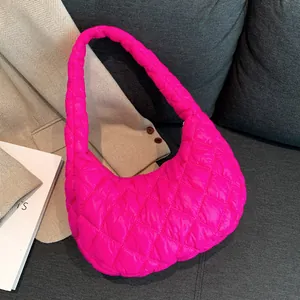 Quilted half-moon puffer bag in hot pink nylon with diamond stitching for women